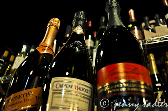 Wine bottles in various sizes close up photograph