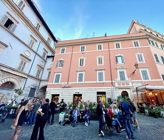 old men play cards while other drink outside Bar San Calisto, Trastevere, Rome
