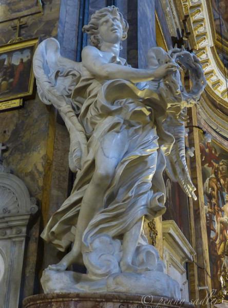 Berninis angel holding crown of thorns.