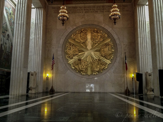 Inside the hall of state there is a lot of gold leaf. Art deco design is showcased on the Esplanade at Fair Park.