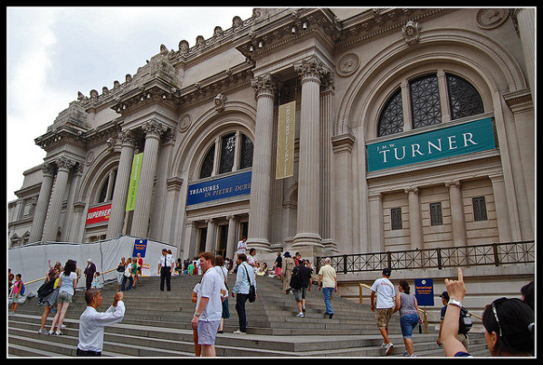 Crowds gather outside The Metropolitan Museum of art.