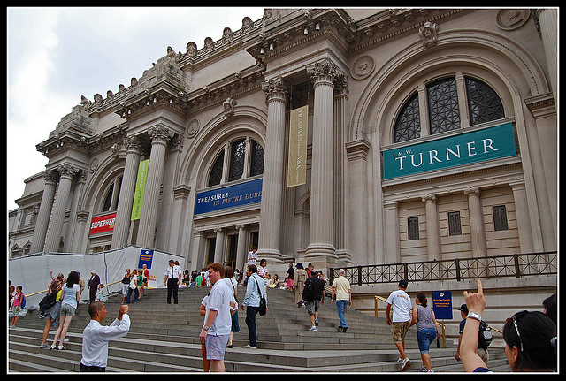 Crowds gather outside The Metropolitan Museum of art.