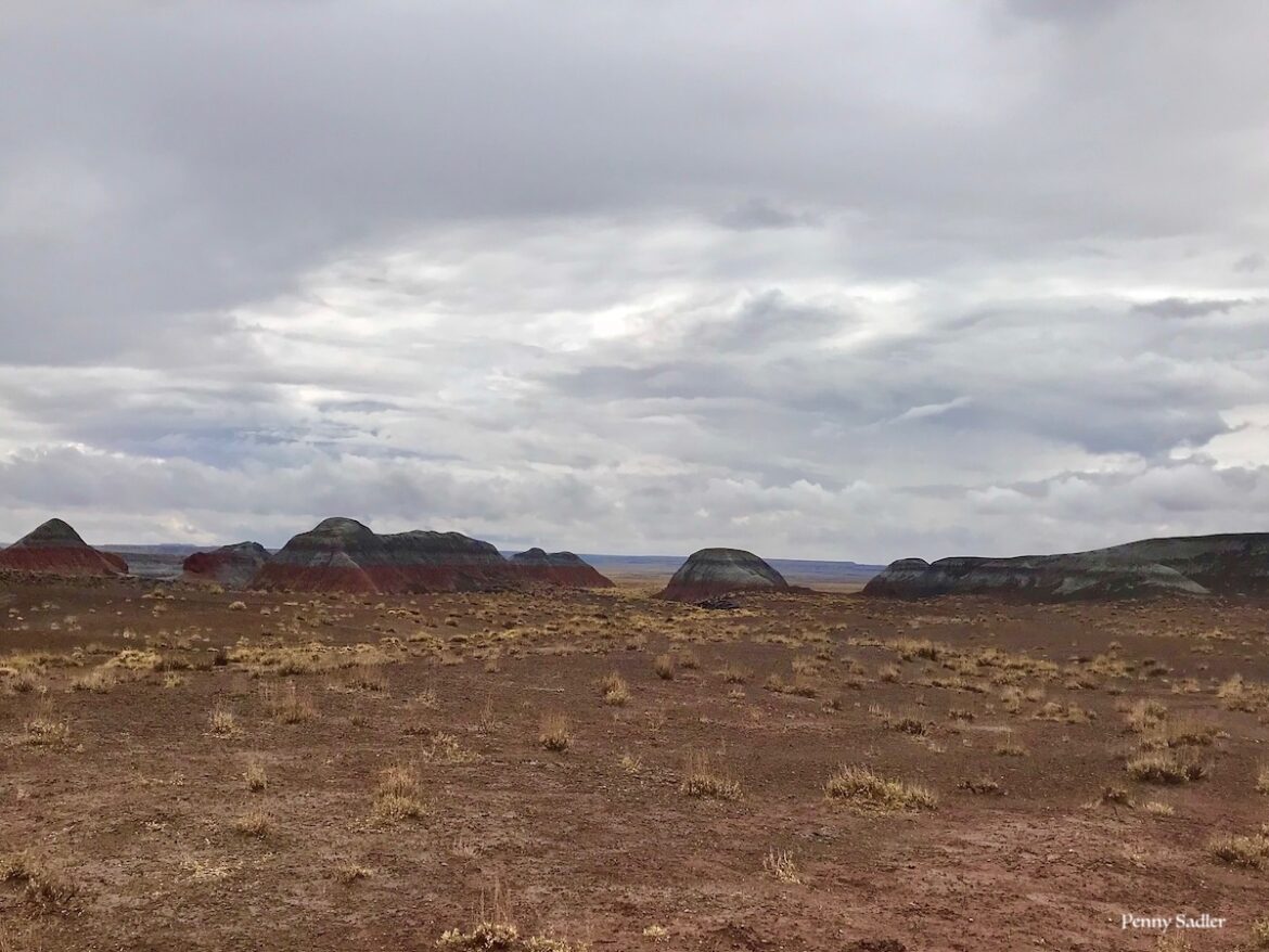 colorful layers of sedimentary rock form the Tepees in the Arizona Painted Desert.