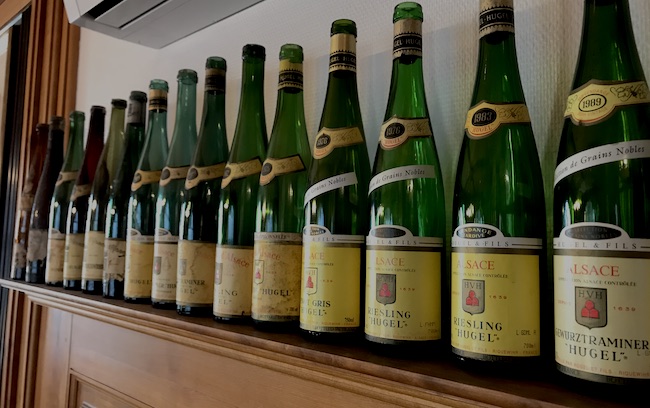 Bottles of wine on the shelf at the Hugel tasting room in Riquewihr, Alsace