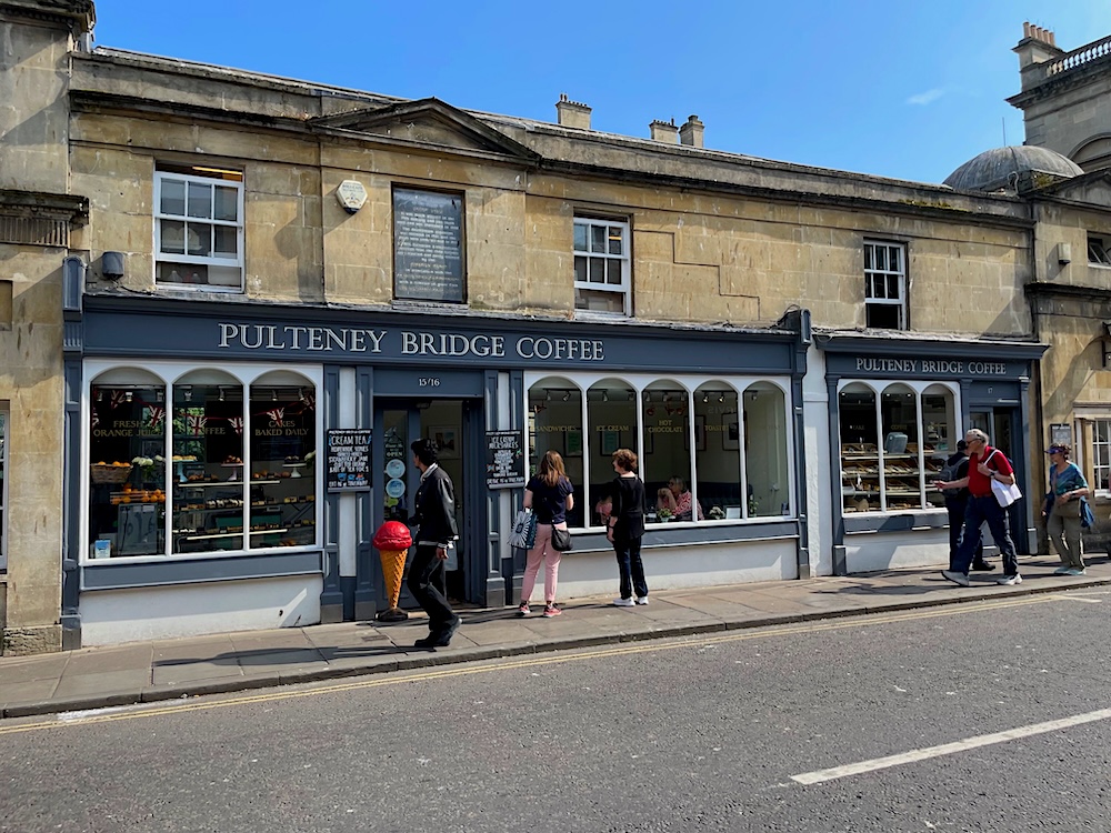 shops and cafes on Pulteney Bridge, City of Bath, England.