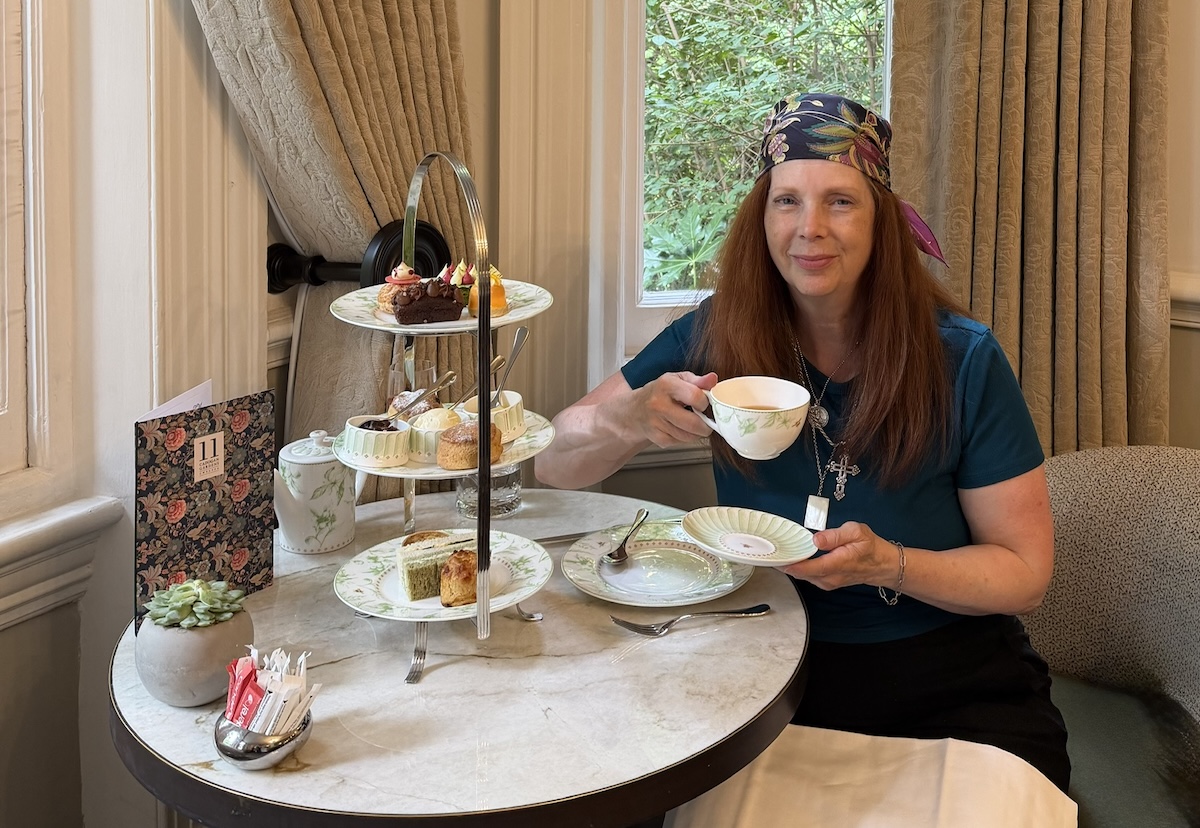 woman in a scarf having afternoon tea, Chelsea Townhouse, London
