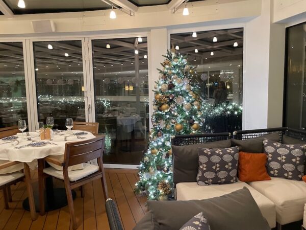 Christmas tree and seating on the Aquivat Terrace, Viking Cruises Longship