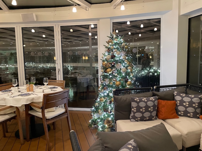Christmas tree and seating on the Aquivat Terrace, Viking Cruises Longship