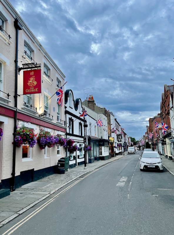 Eton High Street with Bunting and colorful flowers, Berkshire County.