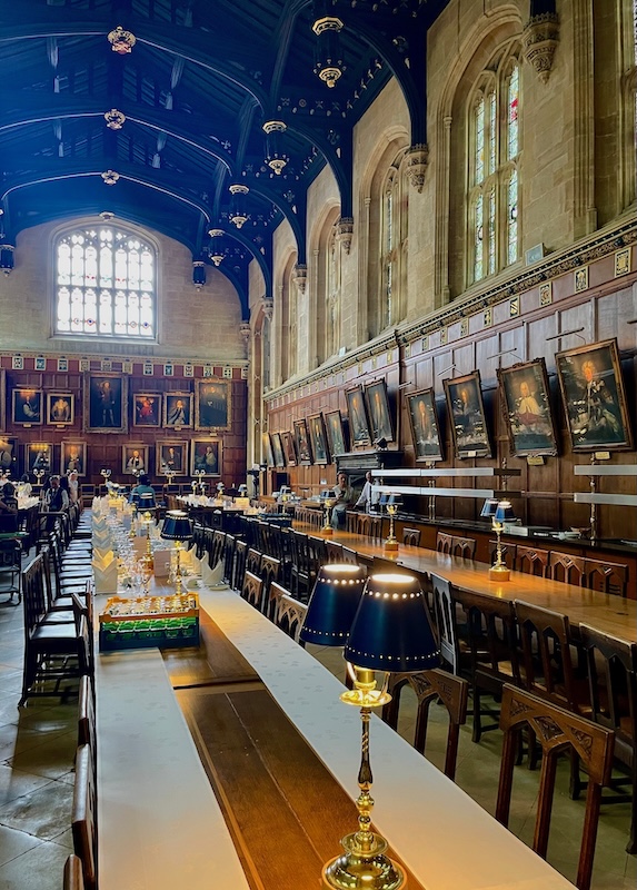 The Great Hall at Christ Church College Oxford. with long dining tables.